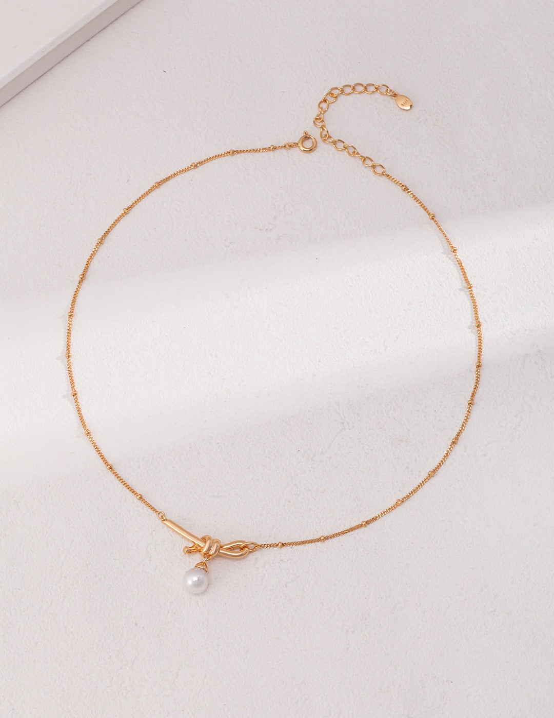 Tied in Time Necklace
